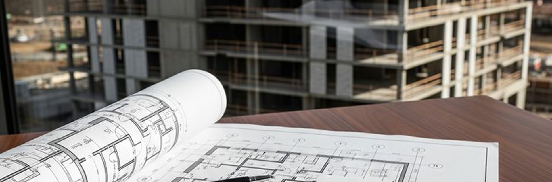 Engineers discussing project documentation of a construction facility